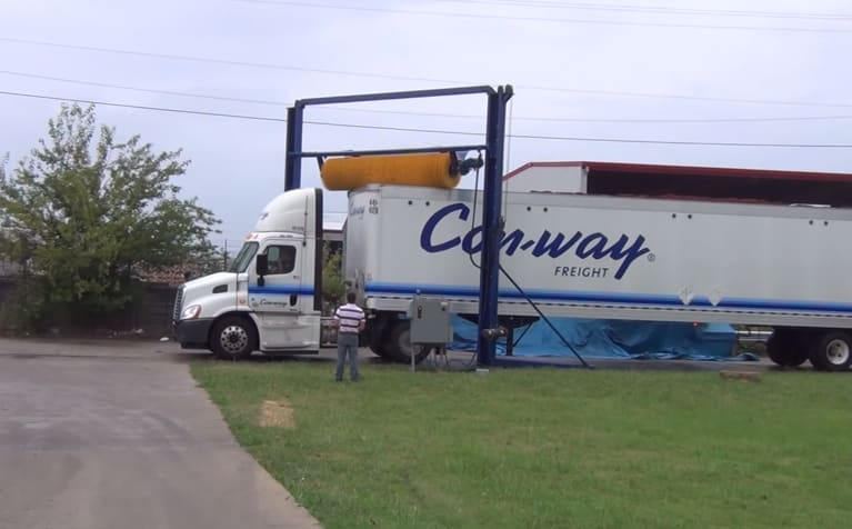 Rotating Brush Cleans Vehicle Tops