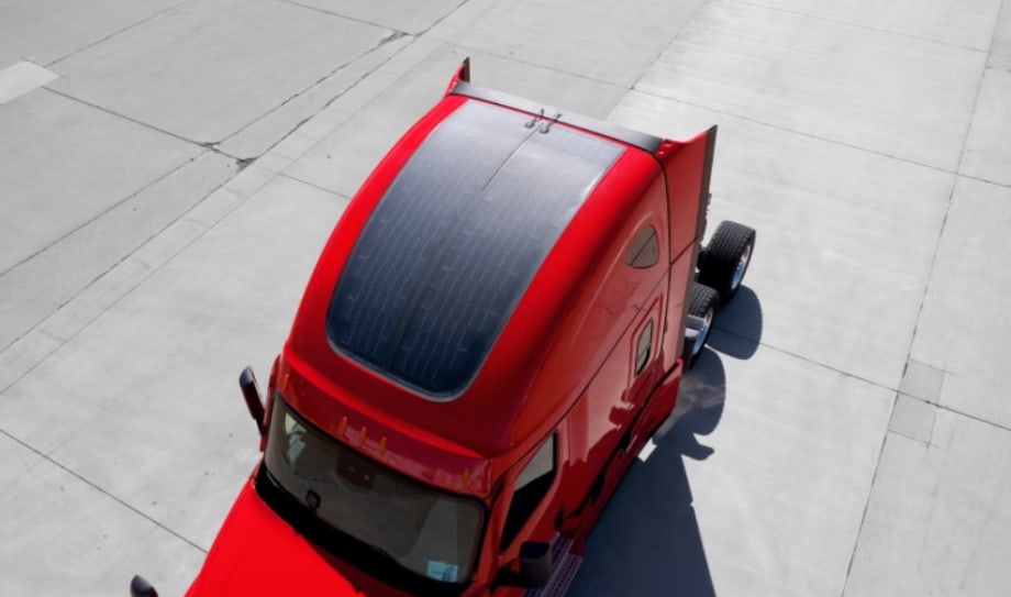Solar panels on top of a red Class 8 truck sleeper cab