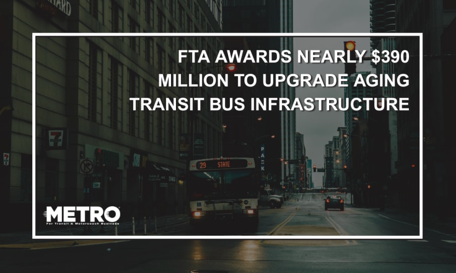 A public transit bus at a pedestrian crosswalk with text reading "FTA Awards Nearly $390 Million to Upgrade Aging Transit Bus Infrastructure Nationwide."