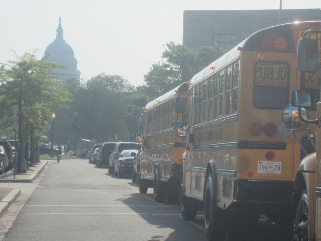 School buses drive Dept. of Education’s Civil Rights Act event