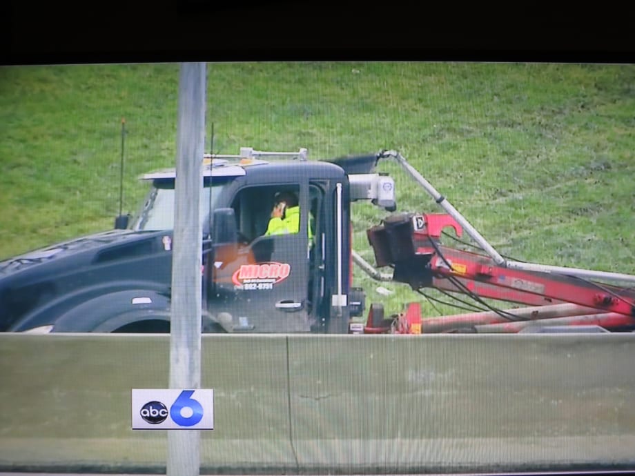 Roll-Off Truck’s Raised Rails Batter a Bridge