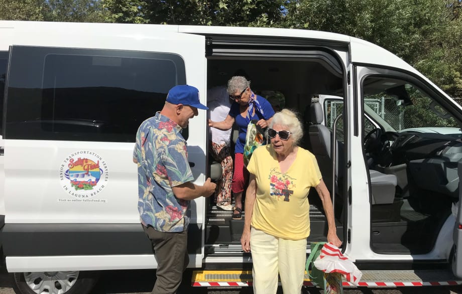 Seniors exiting an OCTA van.