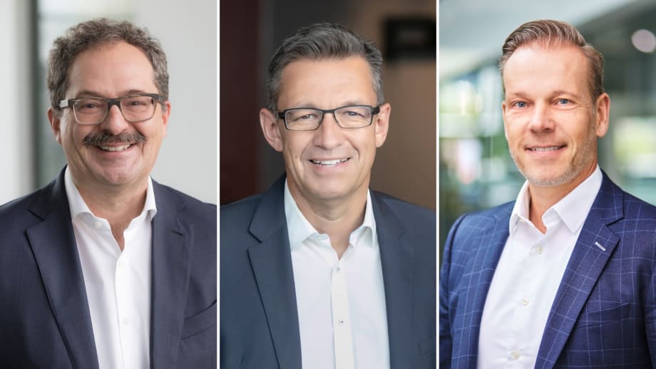 Three men smiling for headshots