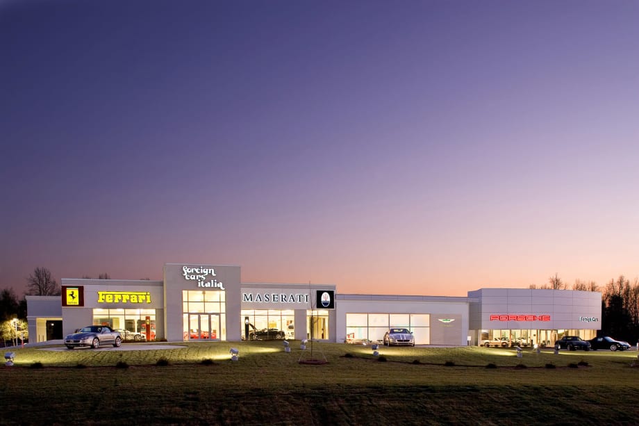 Foreign Cars Italia dealership store in front of sunset