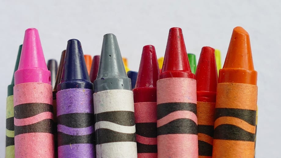 Handful of colorful crayons.