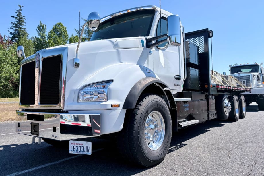 White heavy-duty Kenworth T880e battery-powered straight truck with flatbed