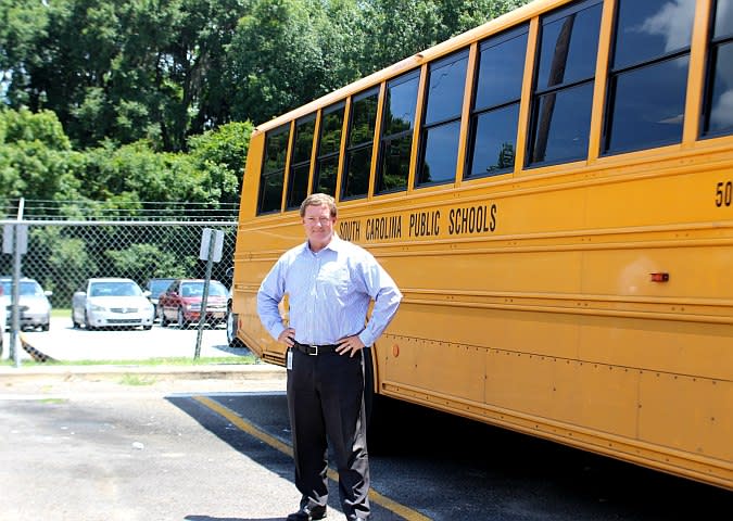 District Brings School Bus Service In-House, Names Transportation Director