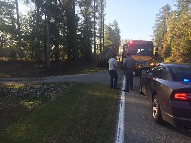 Student Almost Struck By Logging Truck While Boarding School Bus