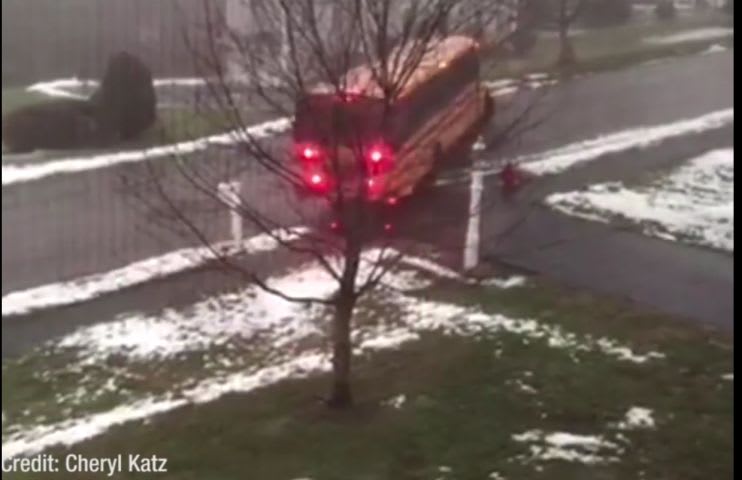 School Bus Slides Down Icy Road, Crashes Into Car