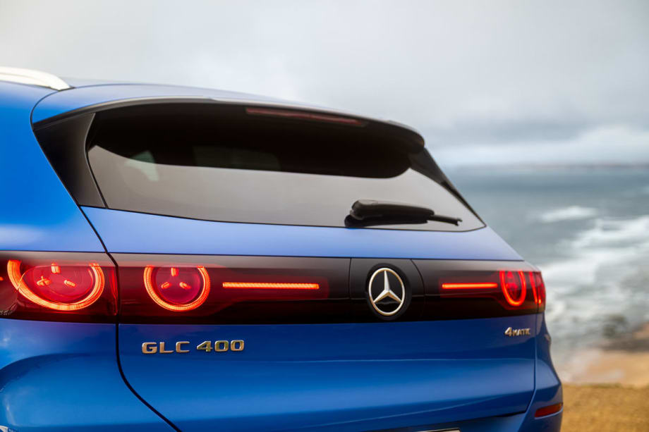 Photo of the rear of a Mercedes GLC 400 electric SUV with a skyline in the background