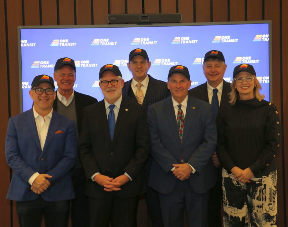 The ONE Transit Board wearing newly branded hats.