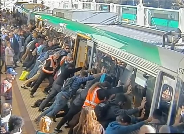 Rail commuters tilt train to free trapped man