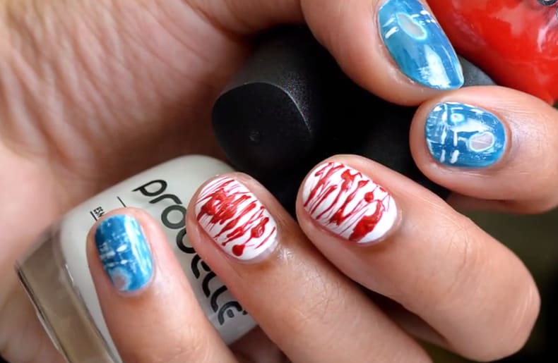 Negative Space Ripped Jeans and Splatter Paint Nails
