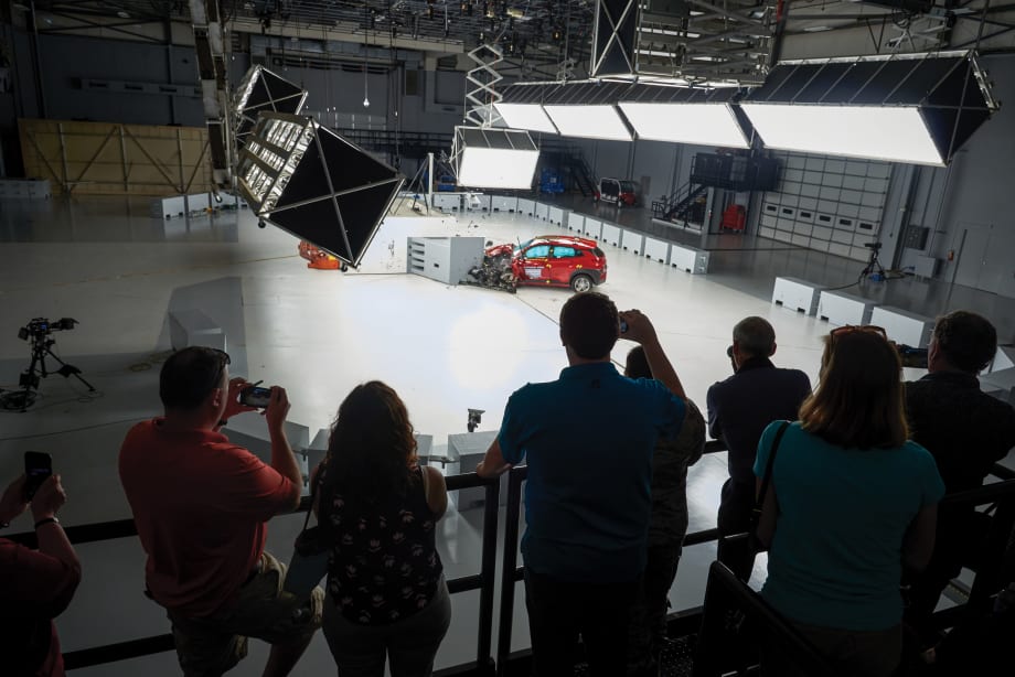 Attendees watch a live vehicle crash test at the IIHS Vehicle Research Center, where fleet professionals can observe safety testing and advanced crash-avoidance technologies in action.