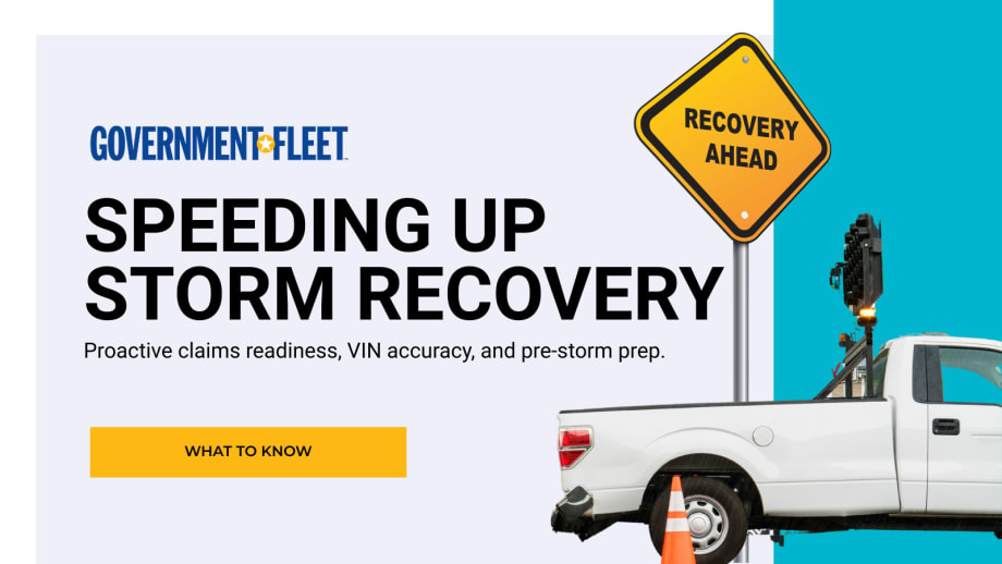 a TRUCK WITH RECOVERY AHEAD SIGN.