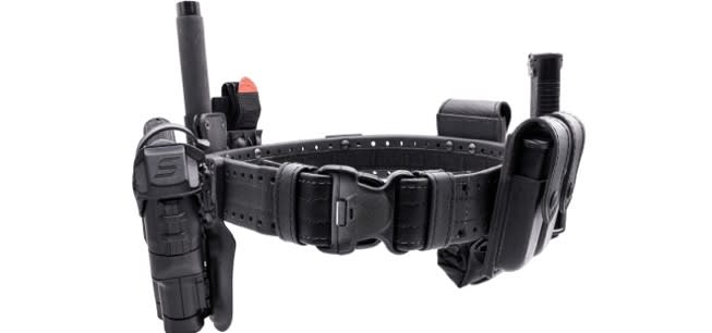 A close up of a police holster with assorted pockets for officers' equipment.