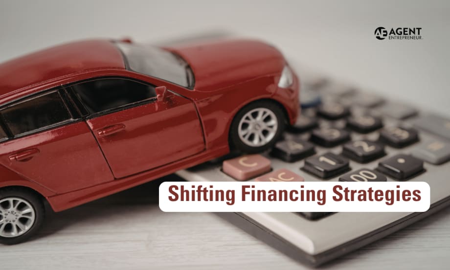red toy car resting on top of a calculator. Agent Entrepreneur logo. Shifting Financing Strategies