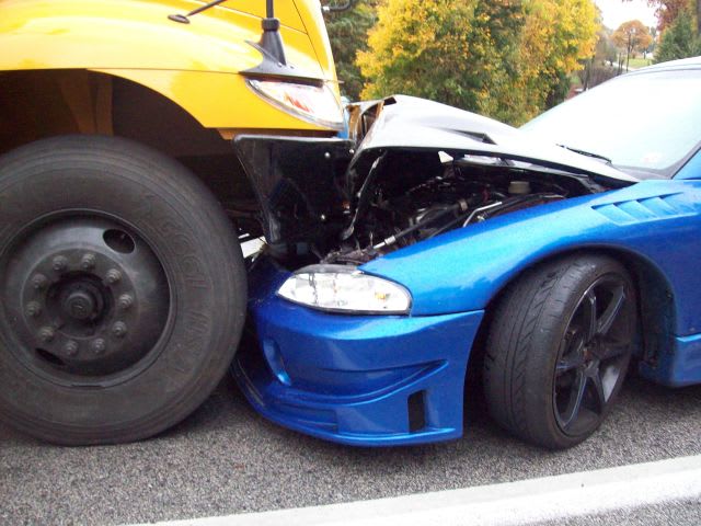 No injuries as car crashes head-on into school bus
