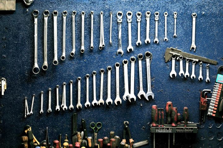 Photo of metal tools lined up in rows on a surface