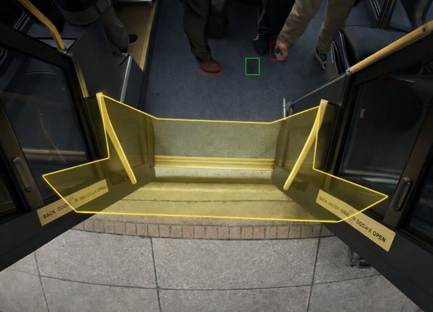 An image of a doorway on a public transit vehicle with a yellow outline overlay.