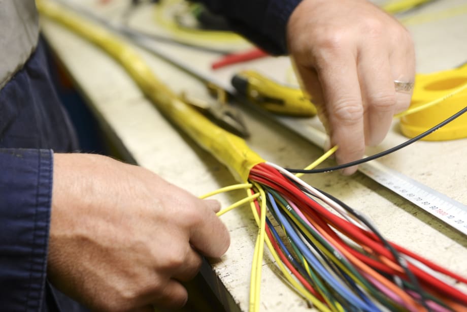 Automakers Consider Lighter, Machine-Made Wire Harnesses