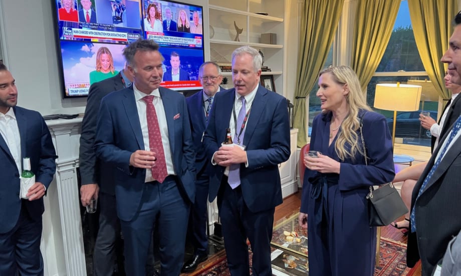 ACRA executives with a Congresswoman in the living room of an event house during a PAC fundraiser.