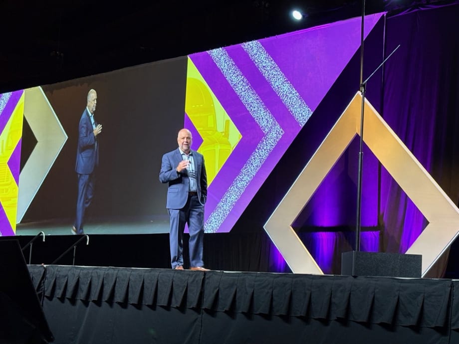 Man on convention stage