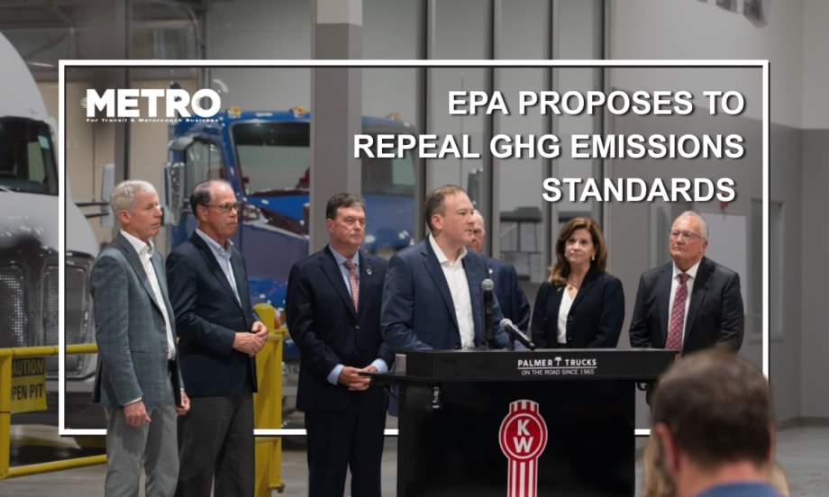 Officials in formal attire stand around a podium.