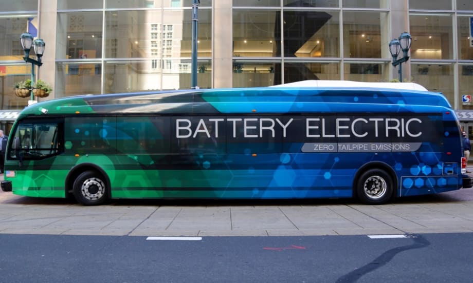 A side view of a blue and green battery electric SEPTA bus.