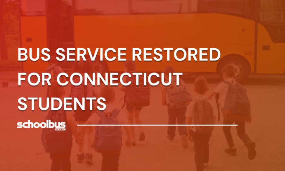 Group of elementary school students with backpacks walking toward a yellow school bus, representing restored bus service for Connecticut students.