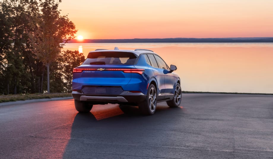 blue 2025 Chevrolet Equinox parked in front of water