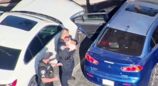 Police officers rescue baby from hot car in California
