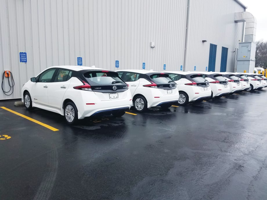 Planning for Fleet Electrification through a Distributed Charging Network