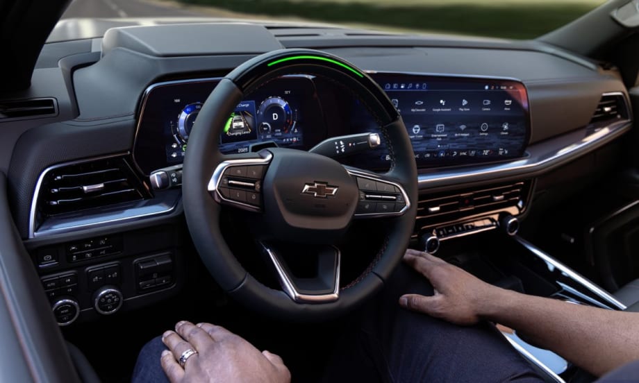 A driver sitting in the passenger seat of a 2025 Chevrolet Tahoe RST while Super Cruise pilots the vehicle.