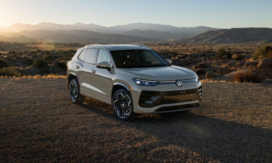 A 2025 Volkswagen Tiguan during sunset with mountain in the background.