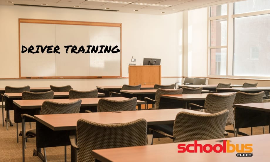 photo of an empty classroom with driver training on the whiteboard