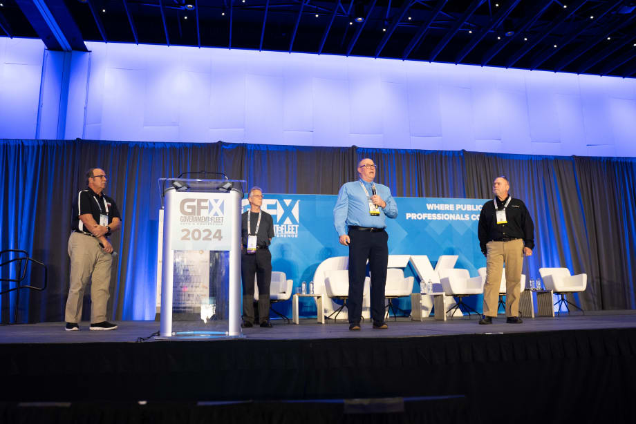 Sam Lamerato from the city of Troy, Michigan; Jeff Tews, retired from the city of Milwaukee, Wisconsin; Kevin Schlangen from Dakota County, Minnesota; and Danny Breshear from AssetWorks stand onstage