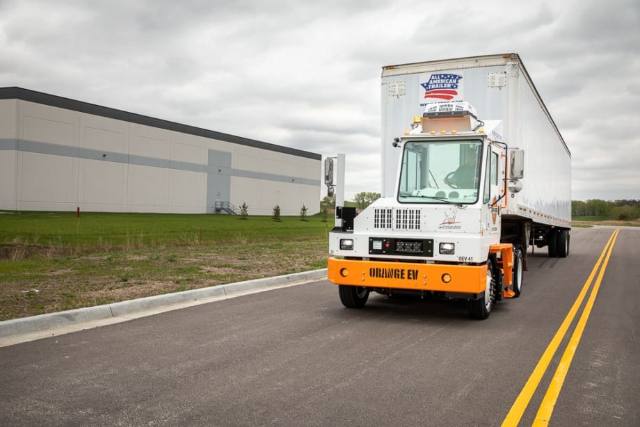 Orange EV terminal tractor.