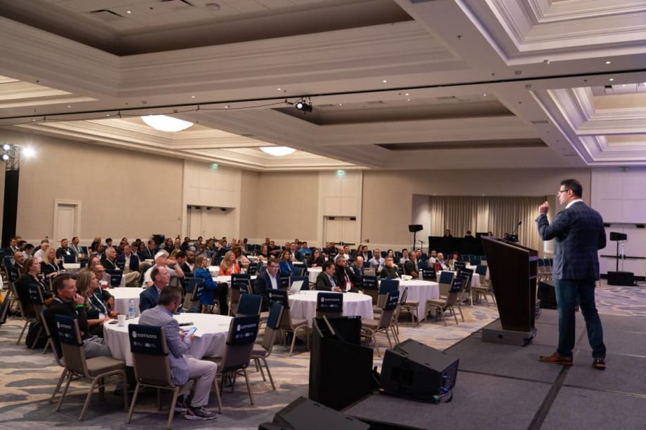 A room of people attending a Fleet Forward Conference seminar.
