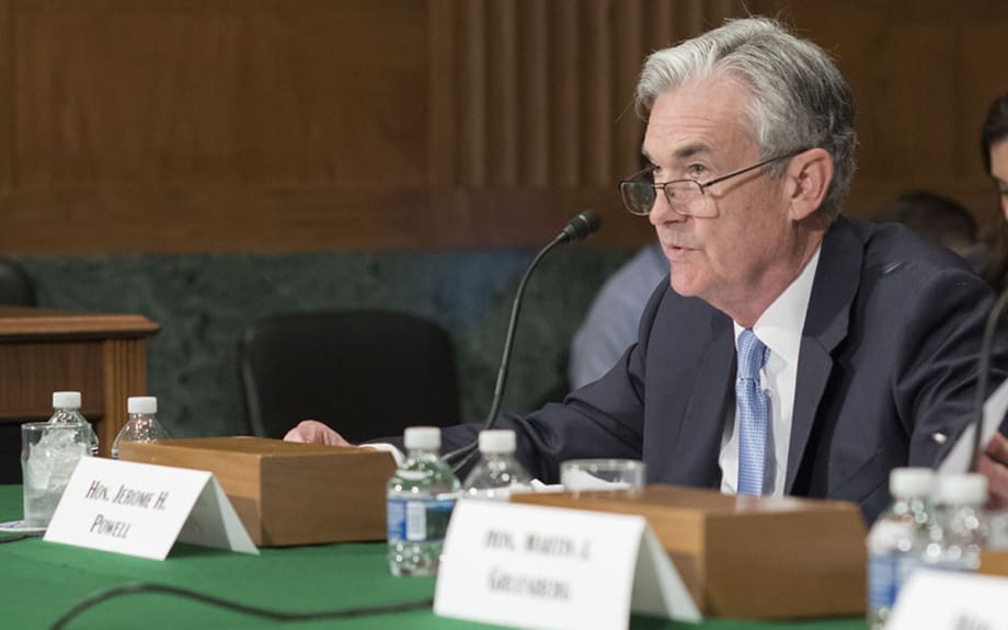Fed Raises Interest Rate, Lowers Growth Forecast