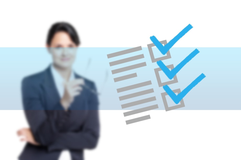 a blurred photo of a businesswoman in the background with a blue checklist overlay