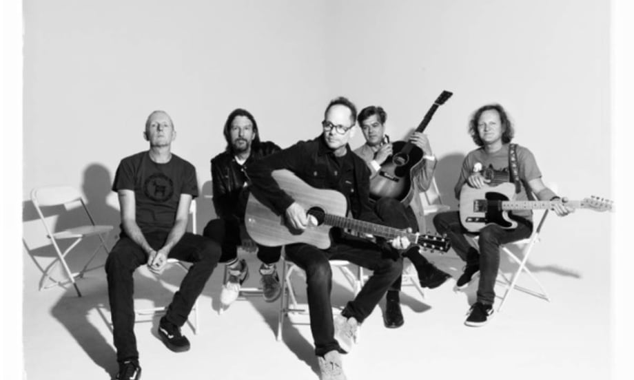 The five members of the Gin Blossoms band with their instruments.