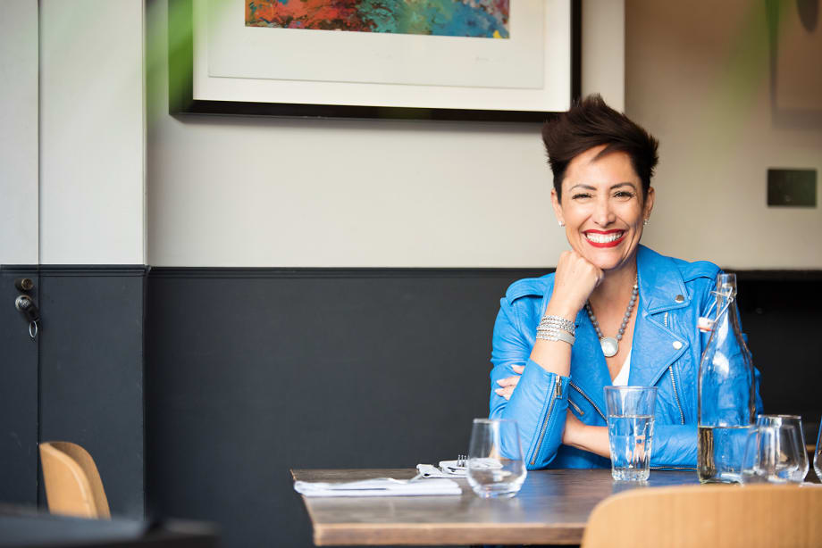 A smiling woman at a desk