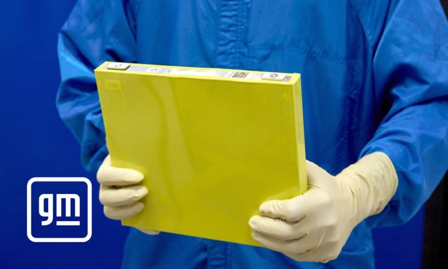 Man holding a new LMR battery by General Motors.