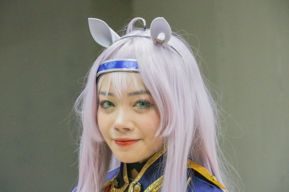 A cosplay character in a hime haircut.
