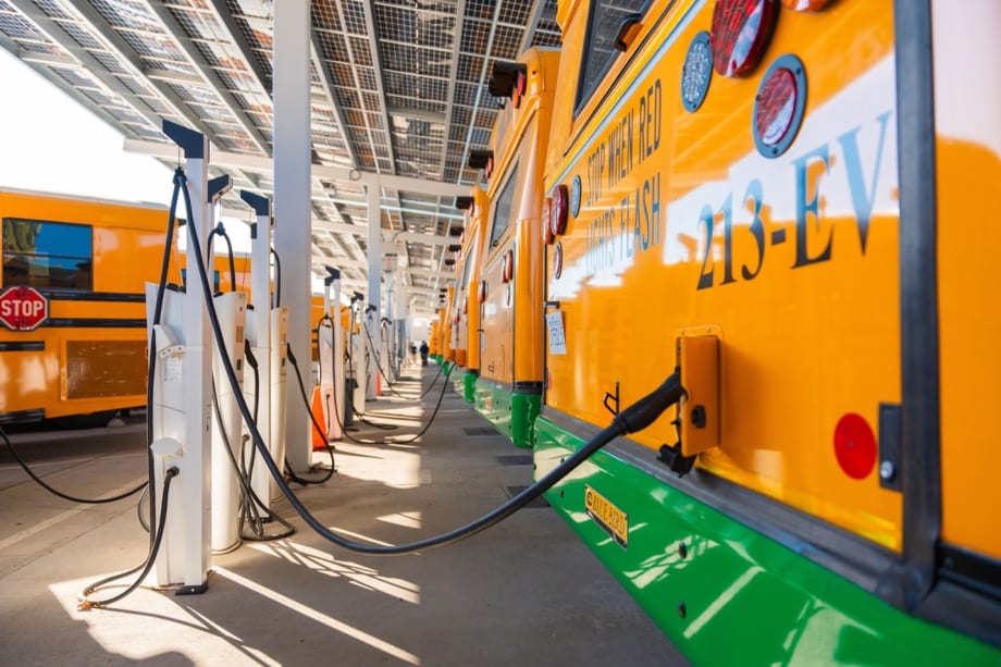 a row of school bus chargers