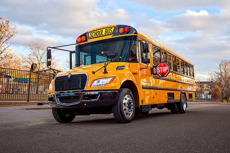 a school bus with illuminated signs
