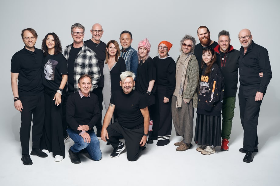 A group of people, many in black clothing.