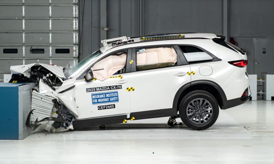 A white 2025 Mazda CX-70 during the updated moderate overlap front crash test.