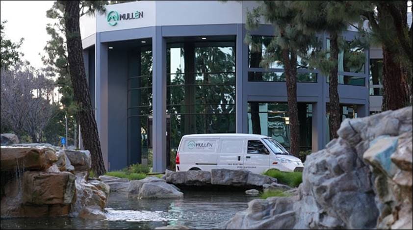 A Mullen Automotive van outside a Mullen facility.